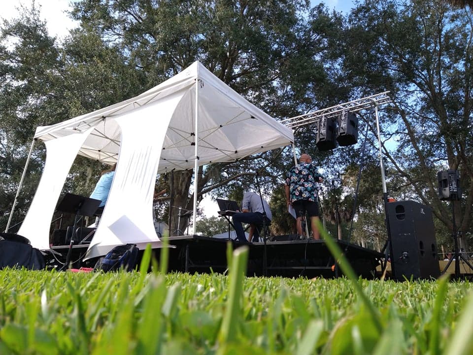 Production support setup with stage, lighting, and PA elements